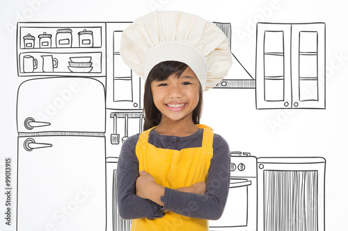cheerful junior chef at home