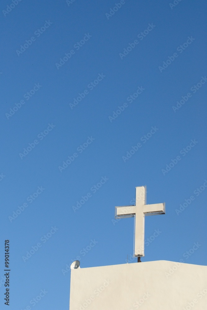 White church cross with blue sky