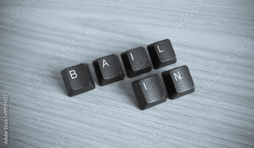 Bail-in wrote with keyboard key in wooden background