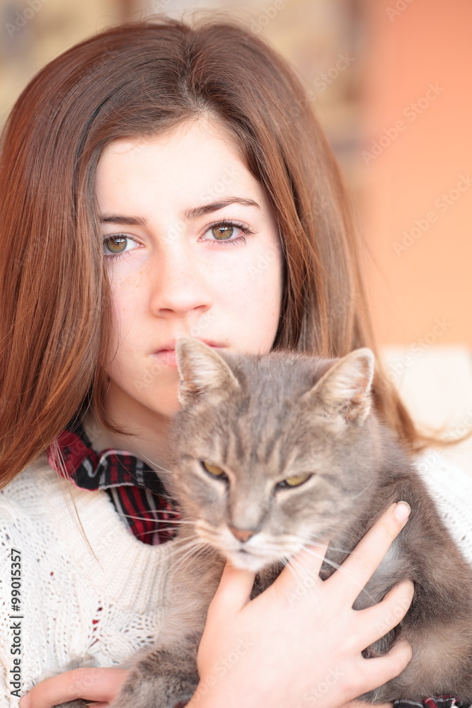 Teenager with her cat in her arms
Teenager with her cat in her arms