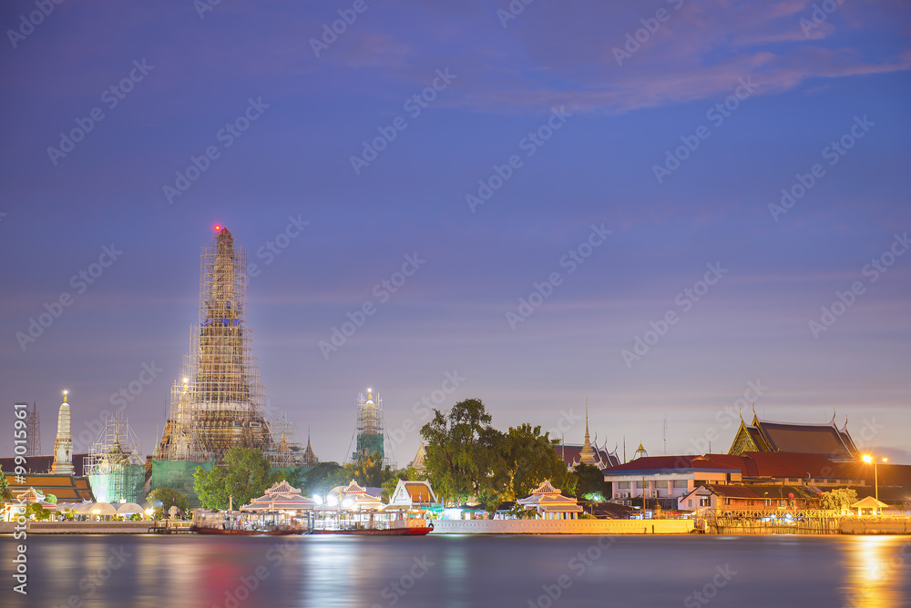 Wat Arun Temple under construction in twilight time at bangkok t