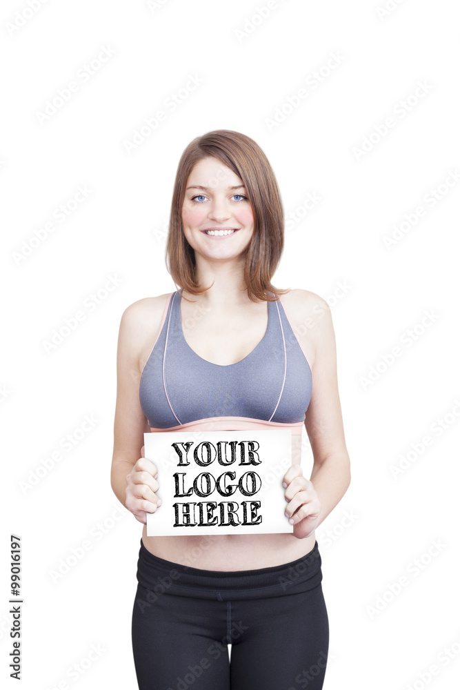 Beautiful sporty young woman holding paper for your logo Beautiful sporty young woman holding paper for your logo