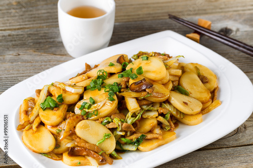 Canvas Print Chinese stir fry sticky rice slices and vegetable dish