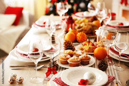 Table setting for Christmas dinner at home © Africa Studio