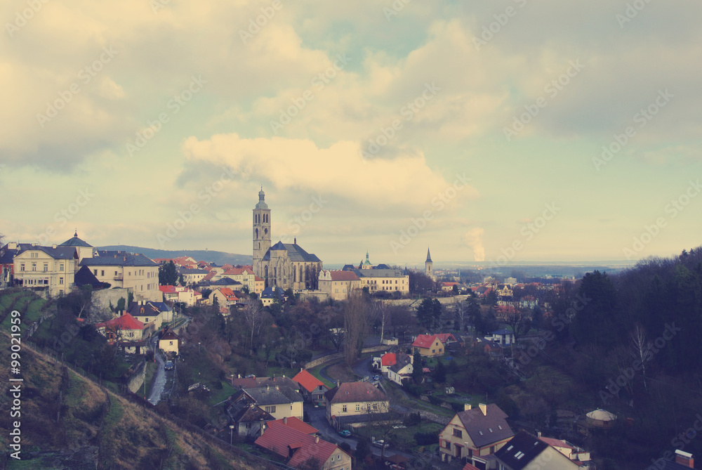 Panoramic view on the Czech historical town of Kutna Hora, located close to Prague and well-known for its Ossuary (Bone Church). Filtered in faded, retro style wtih soft focus.