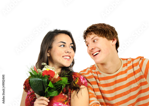 Happy young couple with flowers