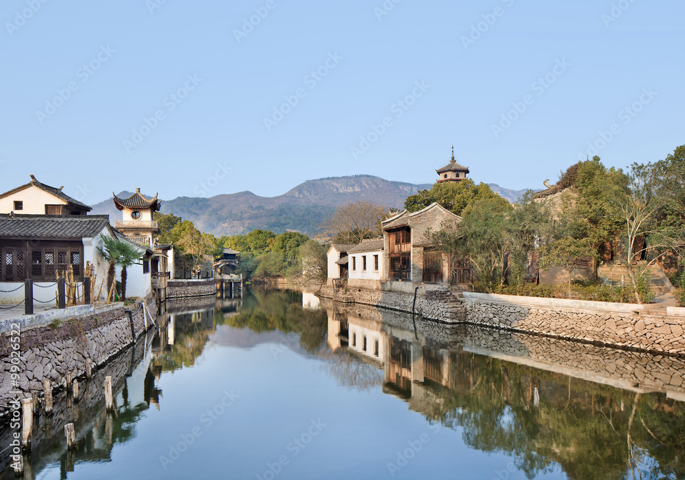 Fototapeta premium Ancient white Chinese houses reflected in a tranquil canal, Hengdian, China