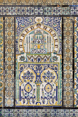 Tunisia. Kairouan - the Zaouia of Sidi Saheb ("The Barber's Mosque"). Fragment of ceramic tiled panel with floral and architectural motifs