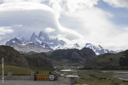 Town of Chalten in foothills of Fitz Roy massif covered with linticular clouds in Los Glaciars National Park. © karenfoleyphoto