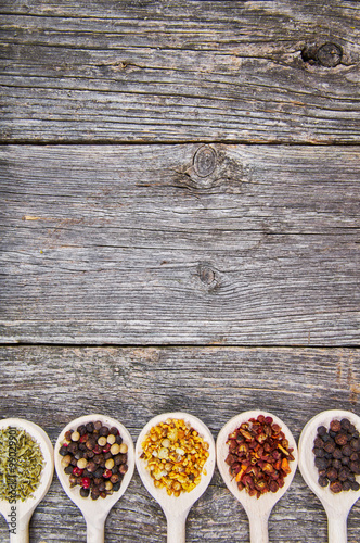 Spices on wooden spoons