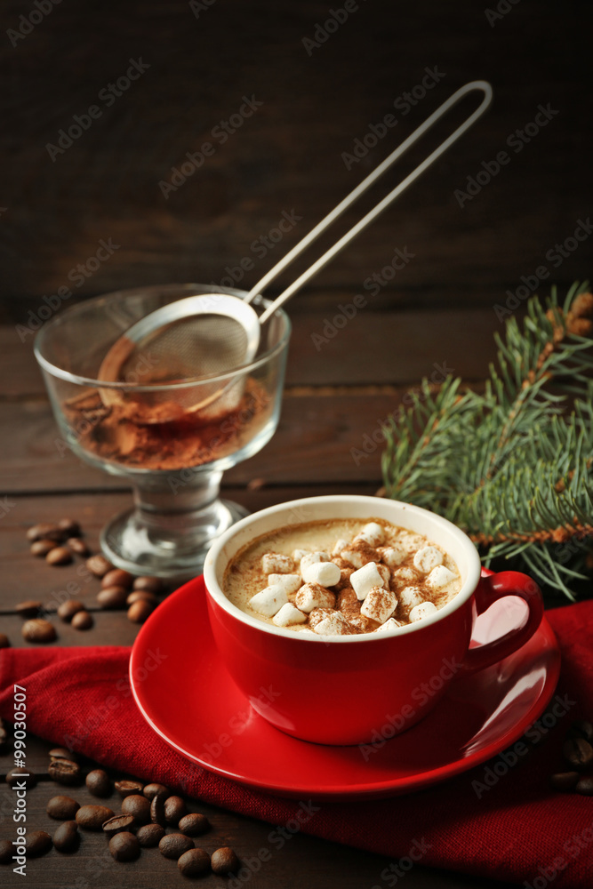 Mug of hot chocolate with marshmallows, fir tree branch on wooden background Mug of hot chocolate with marshmallows, fir tree branch on wooden background