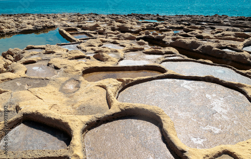 Salt evaporation ponds off the coast of Gozo,Malta.Xatt l-Ahmar. photo