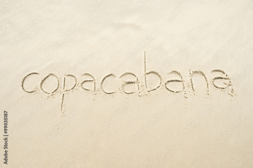 Copacabana, the famous beach, message handwritten on smooth sand in Rio de Janeiro, Brazil
