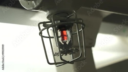 Details of a sprinkler system outlet and thermostat.  Hand help clip, stabilized.