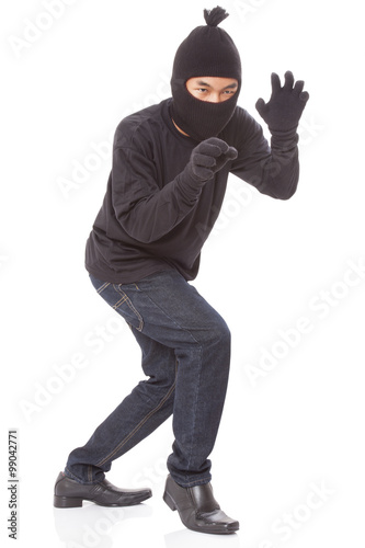 Burglar wearing mask on over white background
