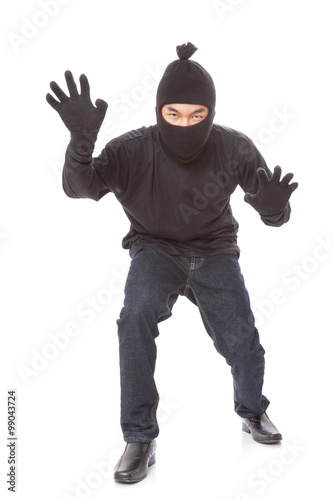 Burglar wearing mask on over white background