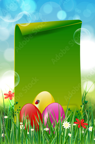 Easter background with easter eggs in grass and paper copyspace