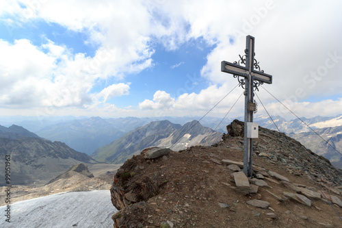 Summit cross on mountain Weißspitze with panorama in Hohe Tauern Alps, Austria