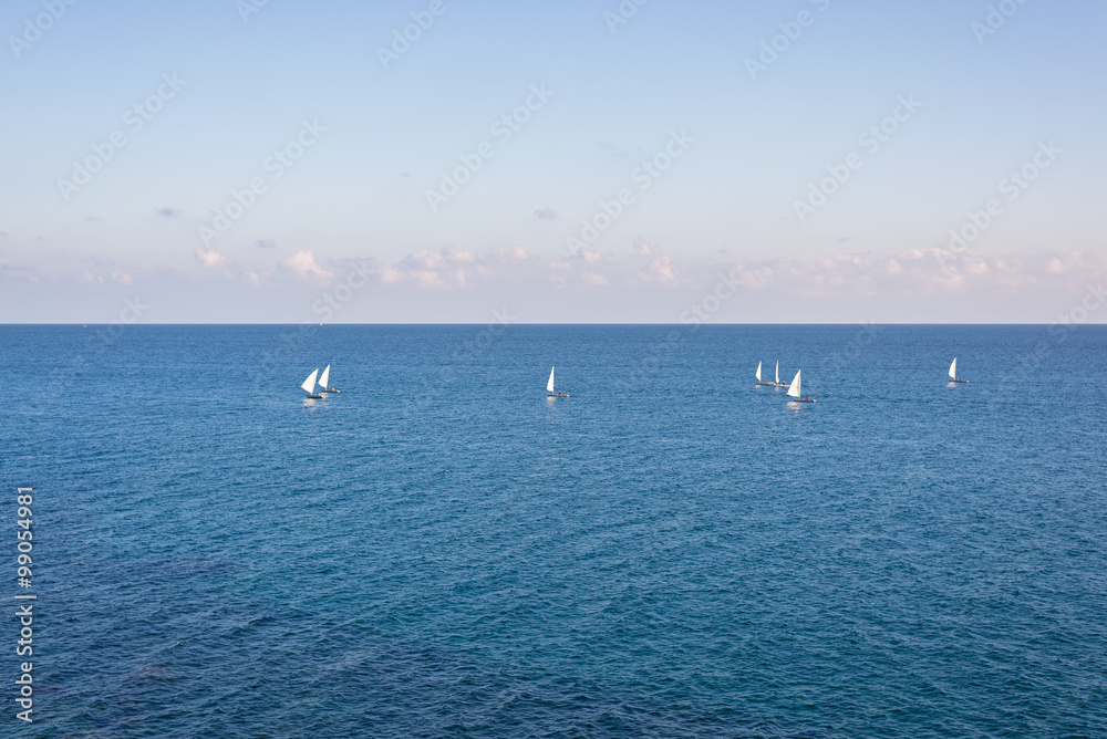 Group of sailing boats on the blue Mediterranean Sea