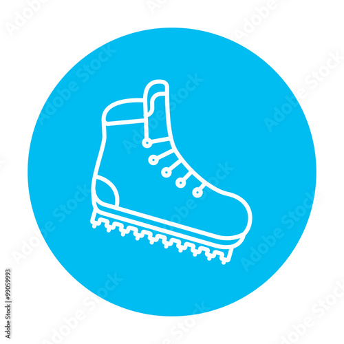 Hiking boot with crampons line icon.