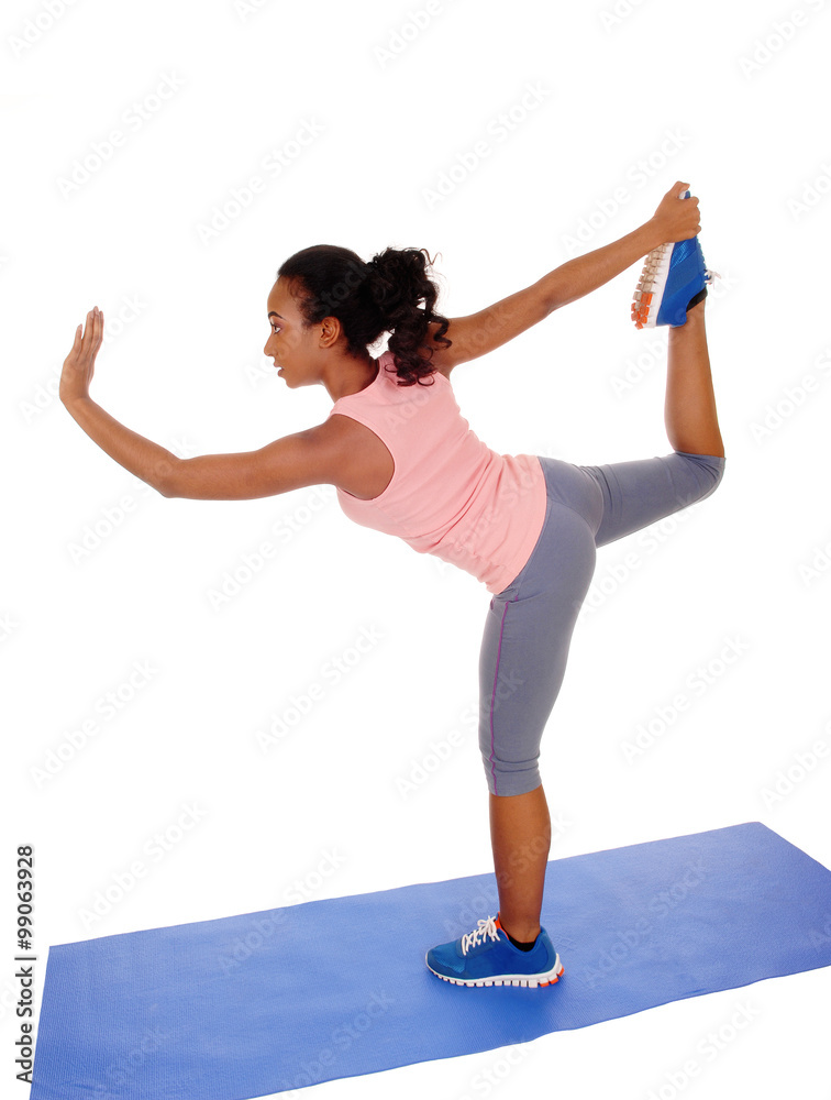 Beautiful African American woman stretching her body. Beautiful African American woman stretching her body.