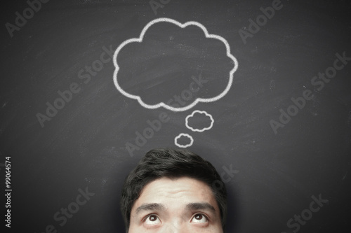 Fotografie, Obraz Thinking man with thinking bubble on blackboard