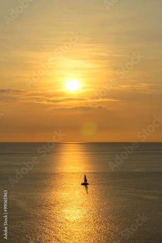 Sunset with boat at Phuket, Thailand