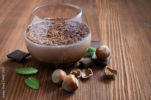 Chocolate mousse dessert with mint and hazelnuts