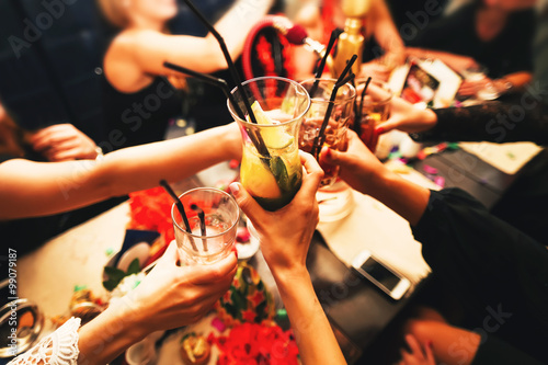 Clinking glasses and toasting