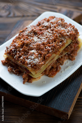 Close-up of lasagna with bolognese sauce and parmesan cheese