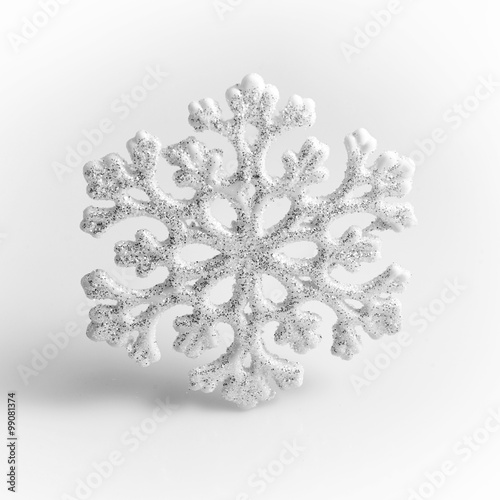 White Snowflake on a white background. Winter symbol