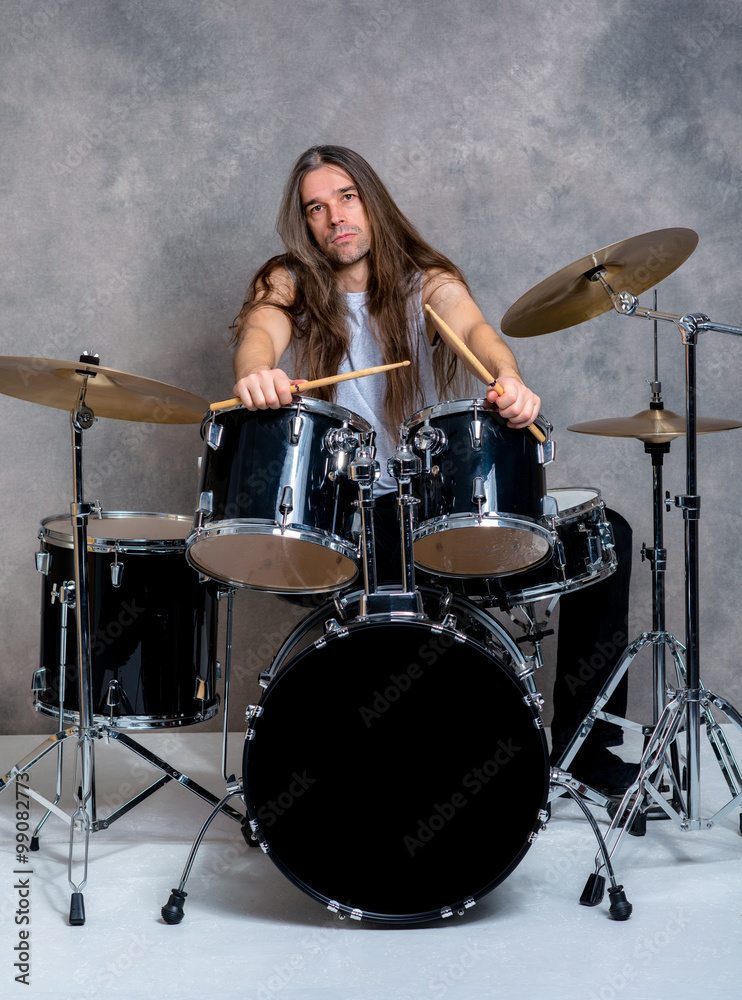 Fototapeta premium musician with his black drum set