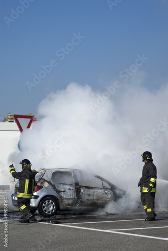 The fireman’s are extinguish a exploded burning car