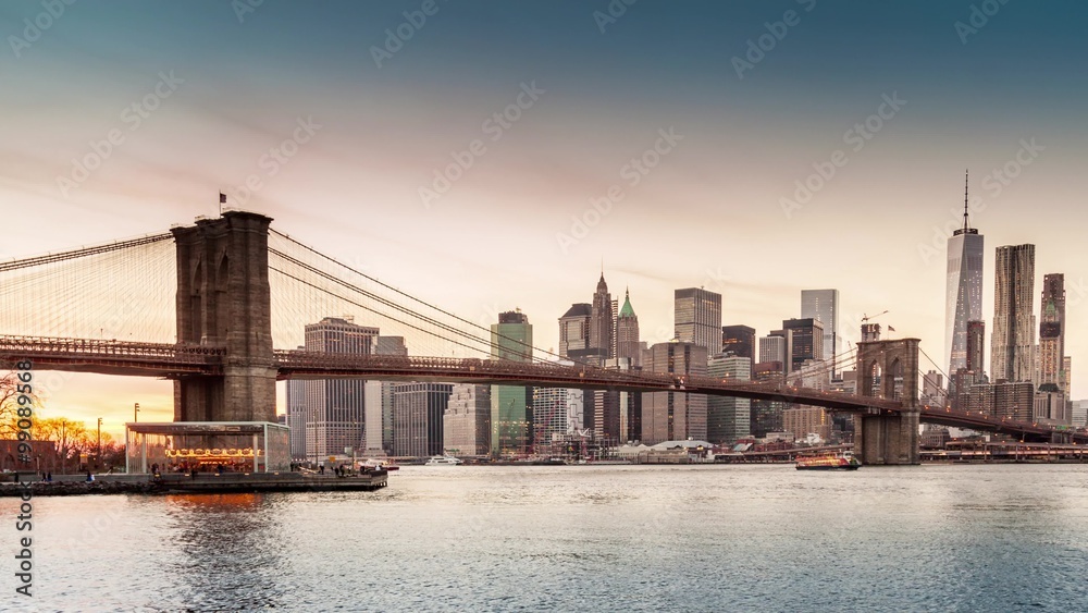 Timelapse with Brooklyn Bridge and Lower Manhattan going through sunset, dusk and night Timelapse with Brooklyn Bridge and Lower Manhattan going through sunset, dusk and night
