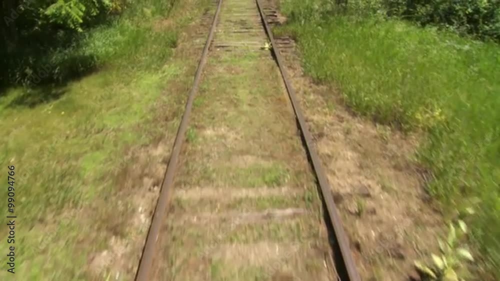 View from train, looking at the tracks while traveling on a country line in the US Mid West. View from train, looking at the tracks while traveling on a country line in the US Mid West.