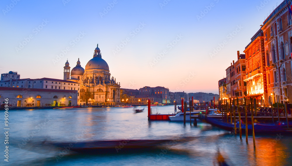 Basilica Santa Maria among the Grand Canal and traditional gondolas in Venice city, 
