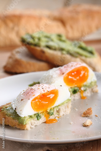 poached eggs with avocado salad .