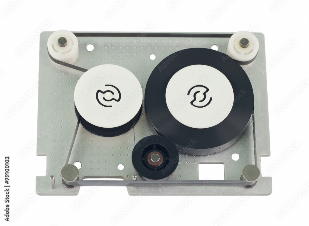 Fototapeta premium Mini data cartridge tape for computer. Cartridge without upper lid. Object is isolated on white background without shadows.