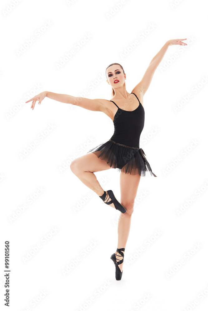 oung beautiful baliet dancer posing on a studio