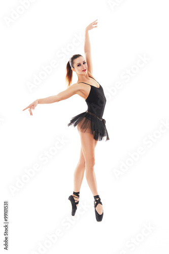 oung beautiful baliet dancer posing on a studio