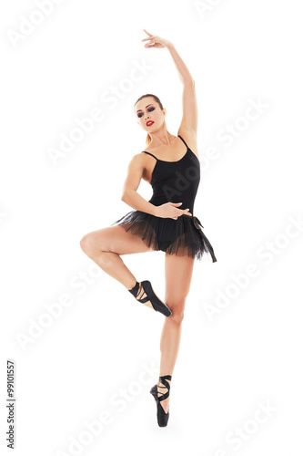 oung beautiful baliet dancer posing on a studio