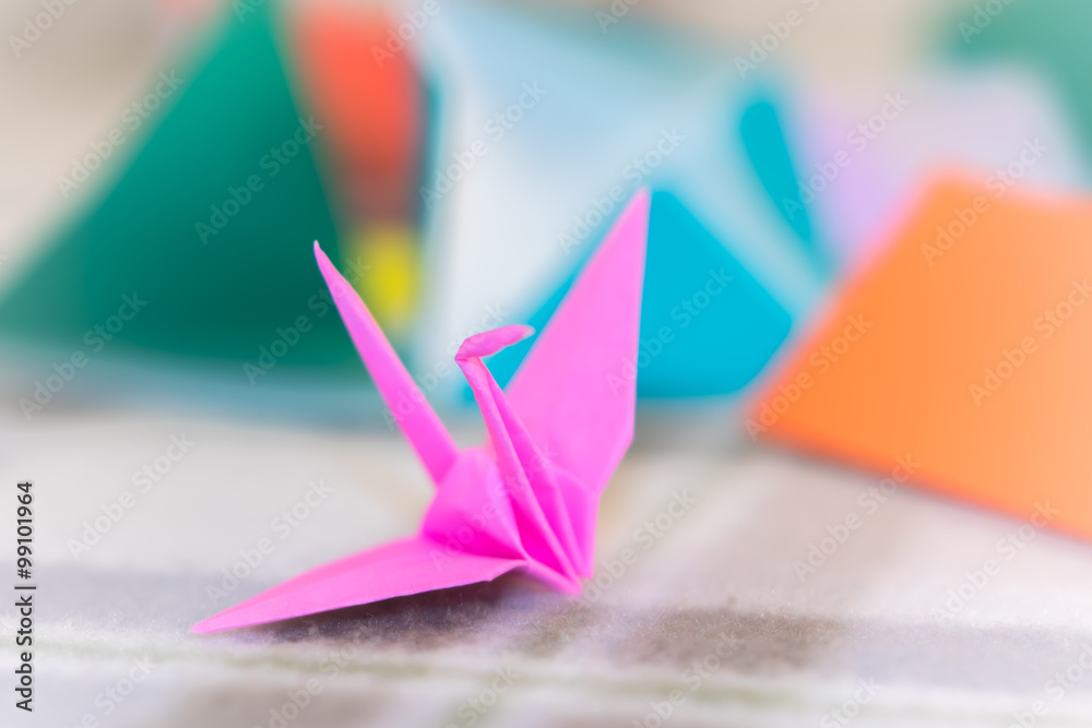 Teaching How to Make Crane from Small Piece of Origami Stock Photo