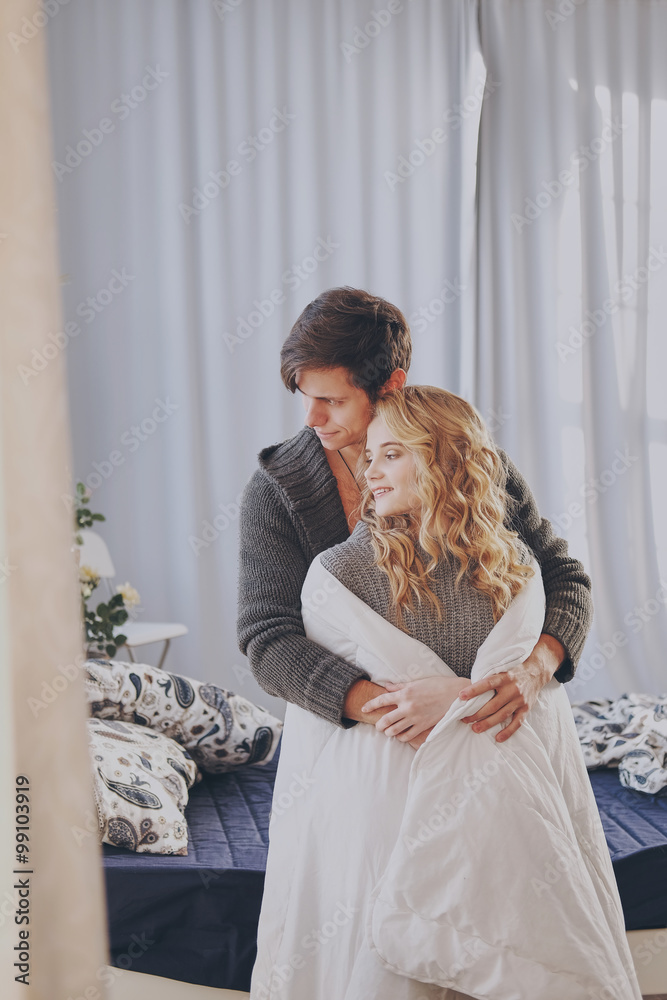 attractive man and woman in the bedroom together cuddling cute attractive man and woman in the bedroom together cuddling cute