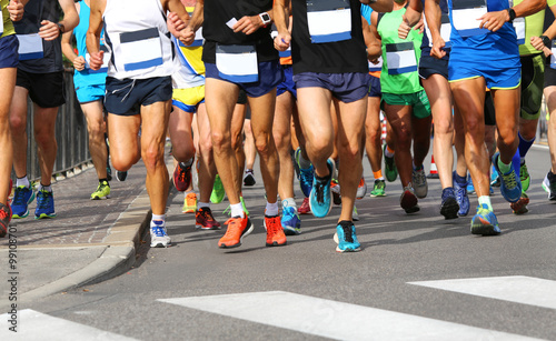 runners during the marathon through the streets of the city