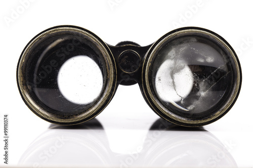 old vintage binoculars closeup on white background