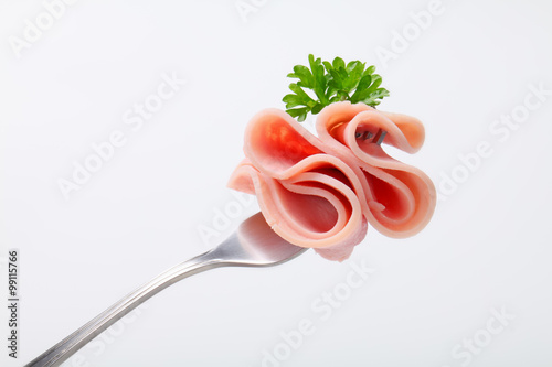 slice of ham on a fork