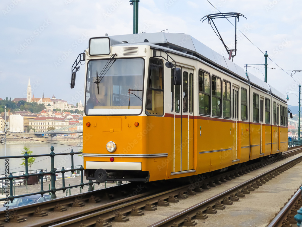 Historic yellow tram on the street, Budapest, Hungary