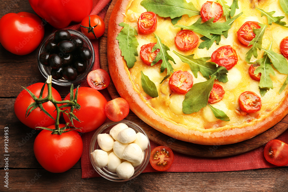Pizza Margherita with arugula and vegetables, close-up