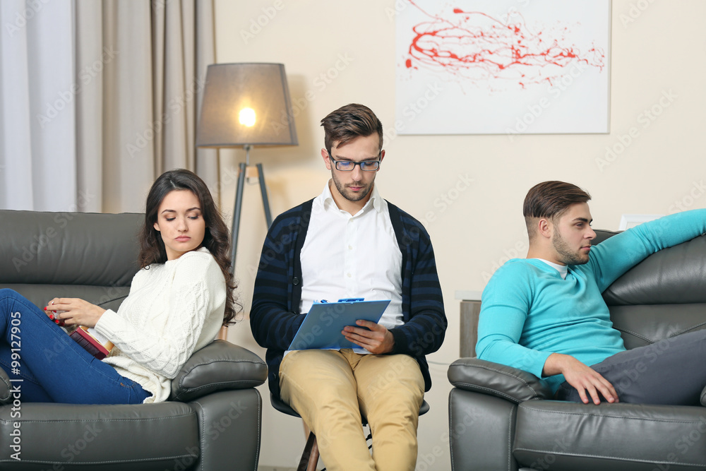 Young couple with problem on reception for family psychologist Young couple with problem on reception for family psychologist
