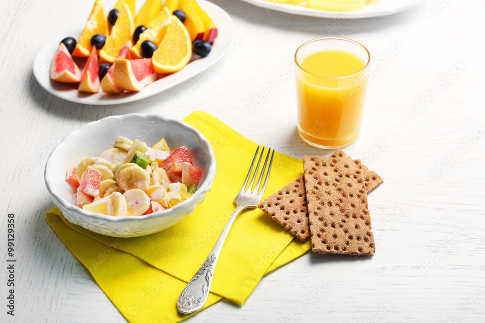 Fruit salad on wooden background. Healthy eating concept. Fruit salad on wooden background. Healthy eating concept.